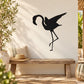 Black flamingo silhouette wall decal, stretching pose with long legs and wings.