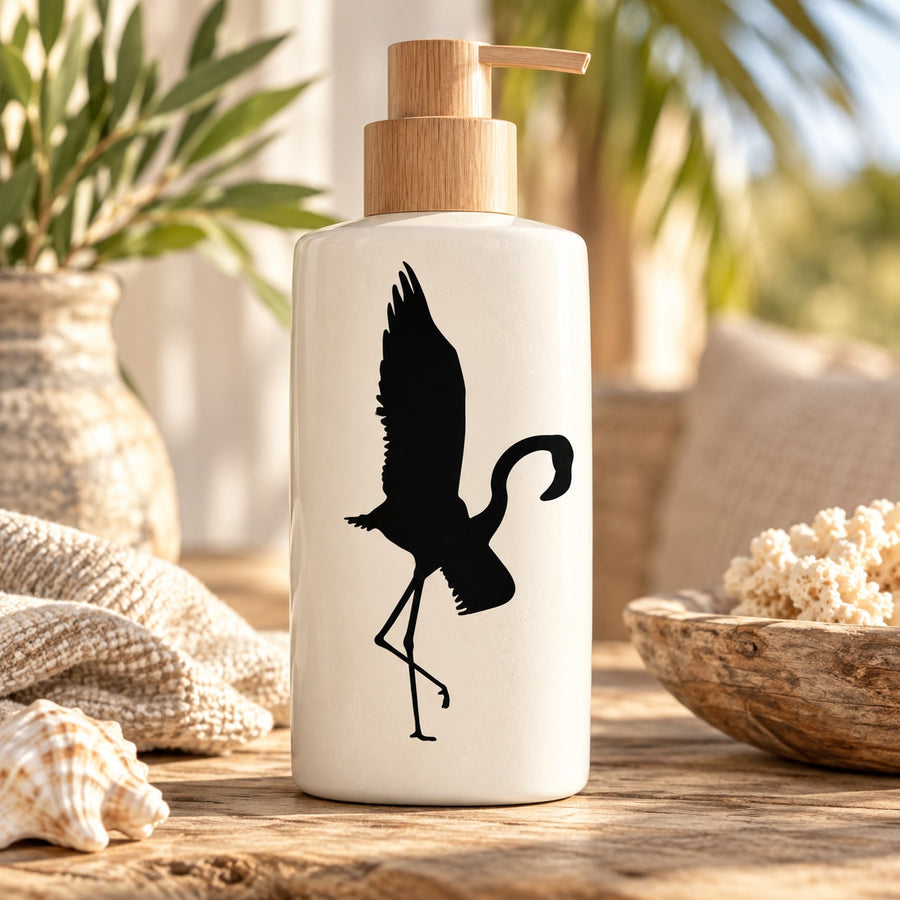 Black flamingo silhouette decal with flapping wings on white bottle