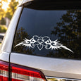 White floral tattoo decal on a car rear window, spread design