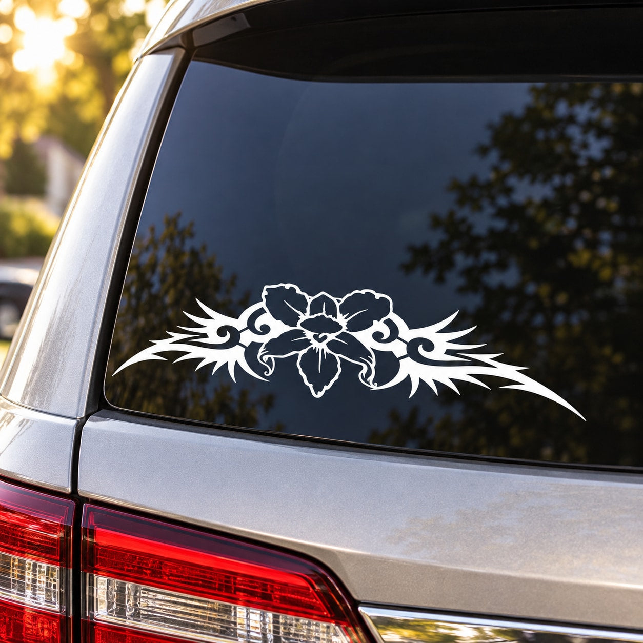 White floral tattoo decal on a car rear window, spread design