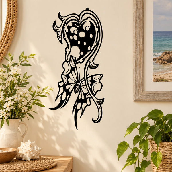 Black ornamental butterfly vinyl wall decal with floral scrollwork and heart-like center.