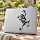 Tree frog swirl decal, black frog silhouette with decorative swirls on light surface