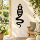 Black abstract tadpole frog wall decal, teardrop silhouette on a light background