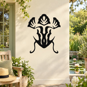 Black frog wall decal with decorative swirl legs and leaf-like accents