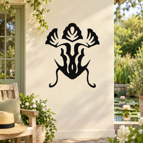 Black frog wall decal with decorative swirl legs and leaf-like accents