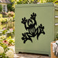 Frog tattoo-style decal, black silhouette on a green surface