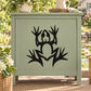 Abstract frog decal with black silhouette and open hands on light surface