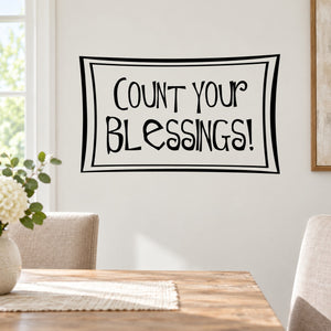 Wall decal with black quote "Count your blessings!" in double rectangular border