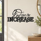Black wall decal with script quote “God gives the INCREASE” and decorative flourish