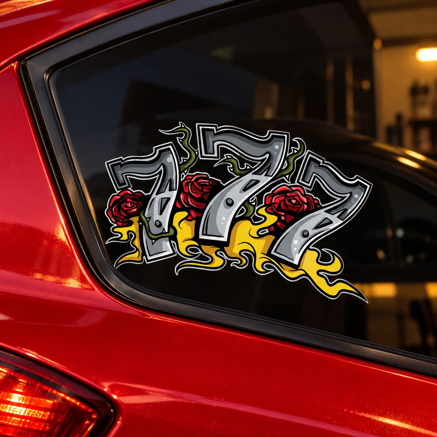 Black car window sticker with stylized 777, red roses, and yellow flames