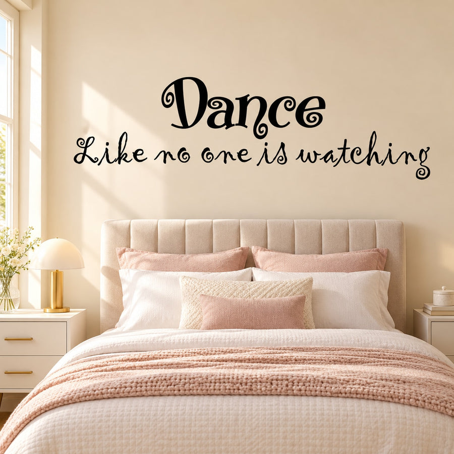 Black wall decal with cursive text: Dance, Like no one is watching.