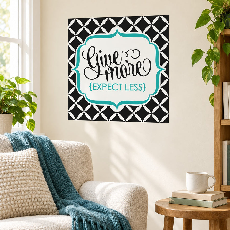 Square wall decal with black geometric border, teal frame, 'Give more' and 'EXPECT LESS'.