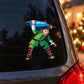 Blue oblong ornament decal of an elf in green carrying a blue item
