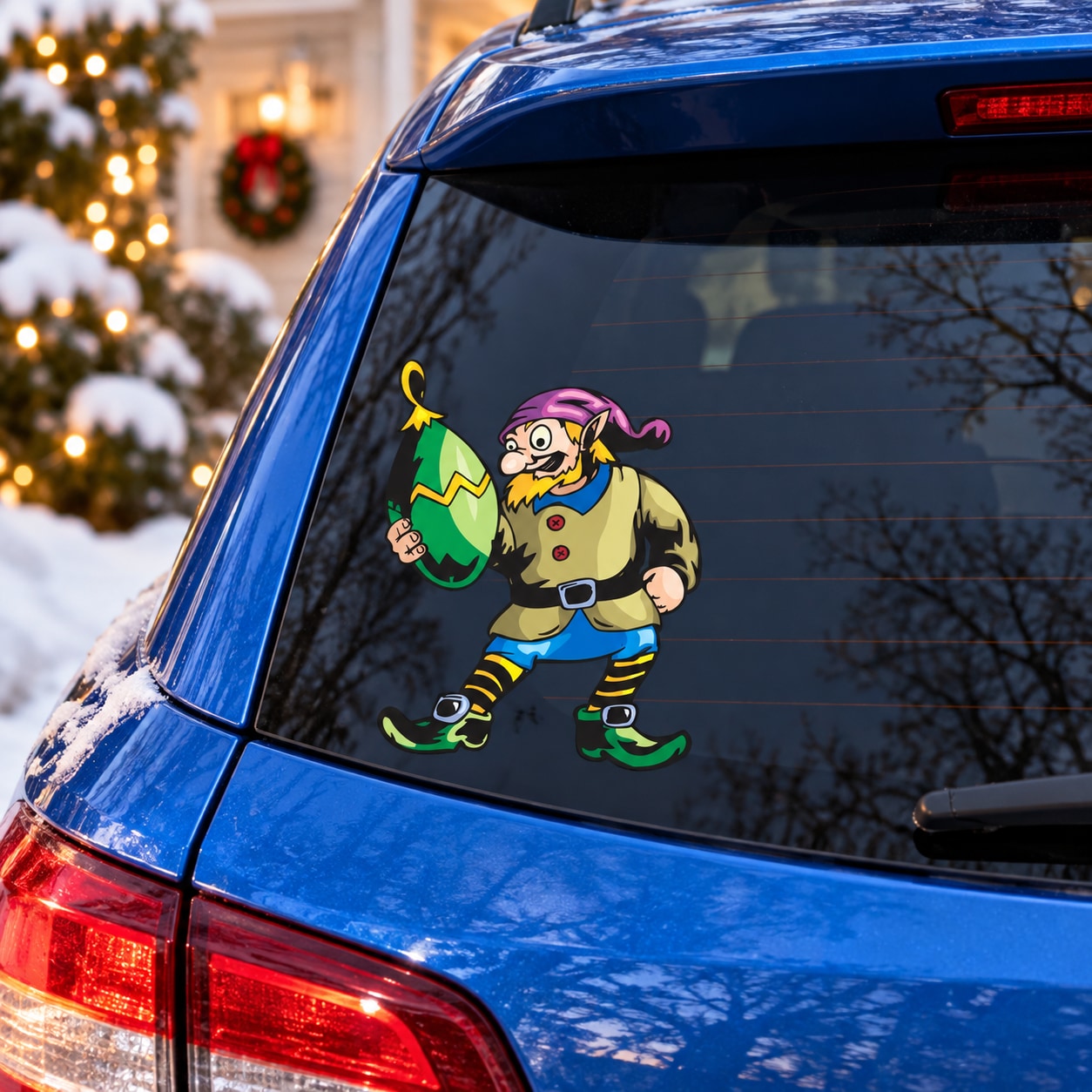 Car window elf decal with green oblong ornament, colorful cartoon figure on black