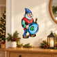 Elf with blue tree ornament sticker, colorful cartoon figure with red outfit