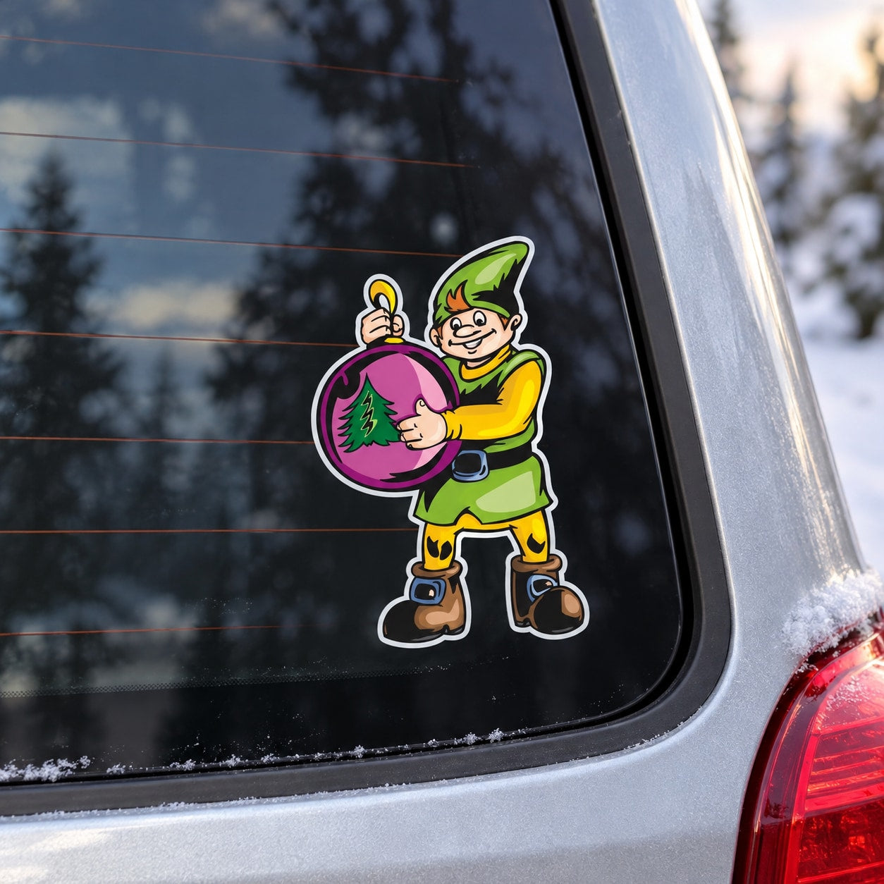 Cartoon elf sticker holding pink tree ornament