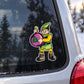 Cartoon elf sticker holding pink tree ornament