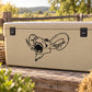 Black goat head decal with detailed outline, shown on a beige surface