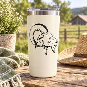 Round goat head outline decal with horns, black ink on white surface