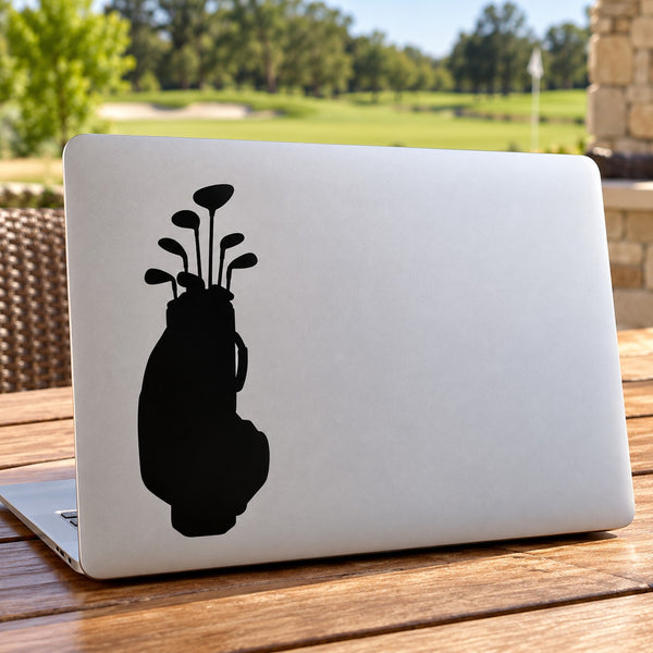 Black golf bag with clubs vinyl decal on light surface