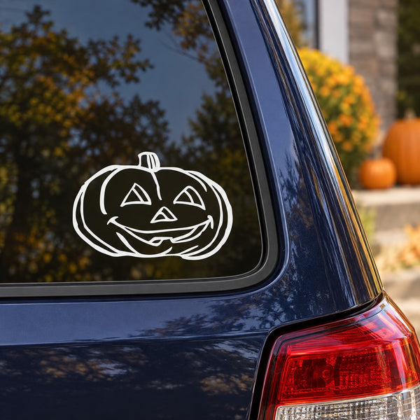 White jack-o-lantern decal on car window