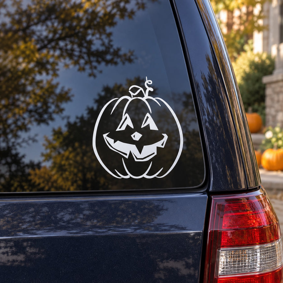 Tall jack-o-lantern decal: white pumpkin face on dark car panel.