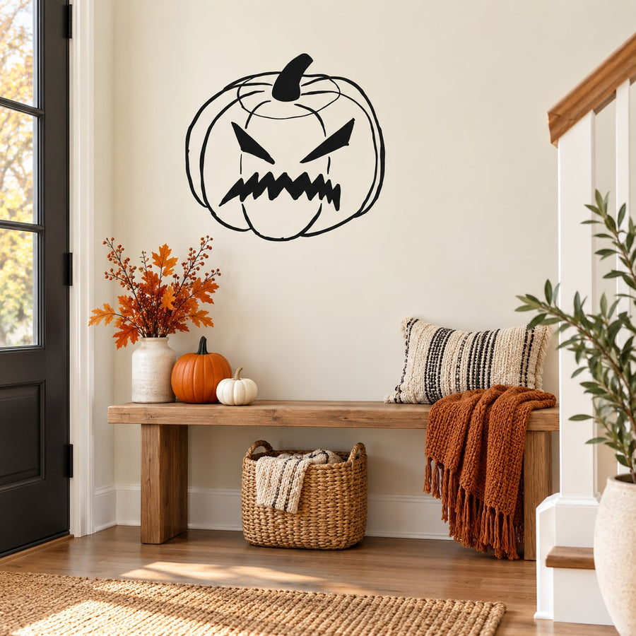 Scary jack-o'-lantern wall decal with jagged grin and carved eyes, black outline