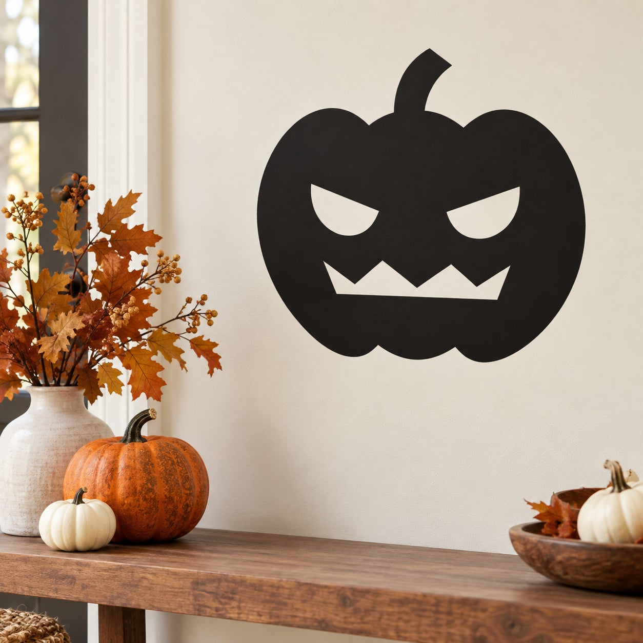 Minimalist jack-o'-lantern wall decal, black pumpkin with carved eyes and smile