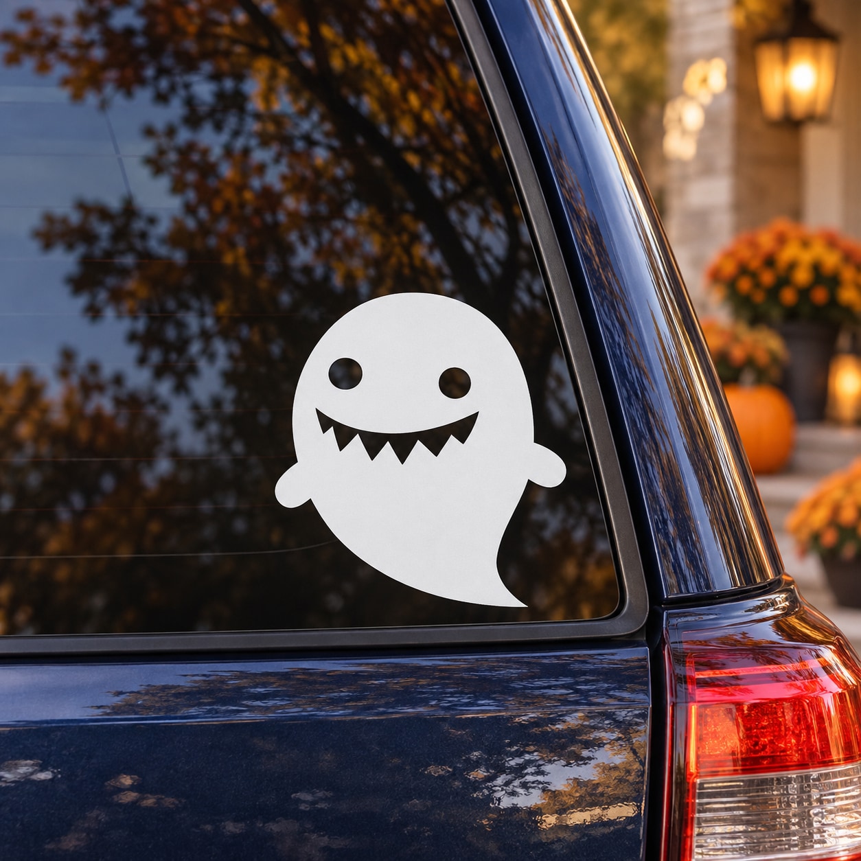 White grinning ghost window decal with cartoon teeth and eyes