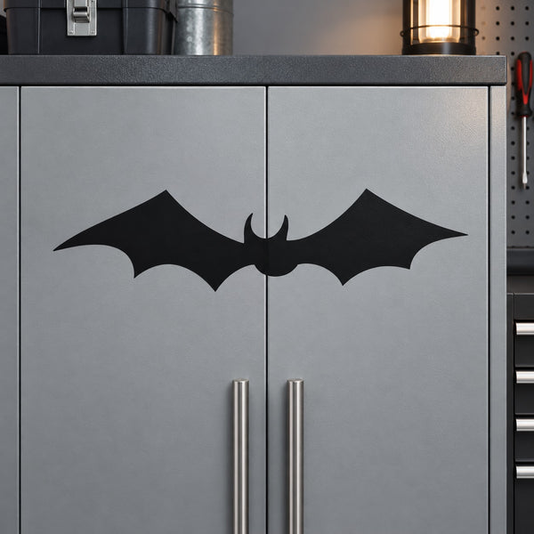 Black bat wall decal with symmetrical wings on gray cabinet door