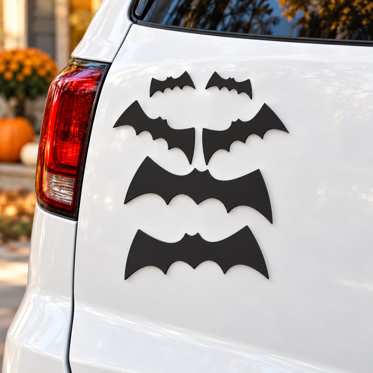 Halloween bats magnet kit with black bat magnets on a car trunk lid