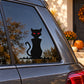 Black cat silhouette sticker with red eyes on a car window
