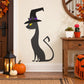 Cat wearing witch hat sticker, black cat with purple band and yellow eyes
