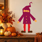 Purple and red cartoon trick-or-treater sticker character with wand and yellow buttons