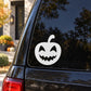 Jack-o-lantern decal: white carved pumpkin smile face on car window