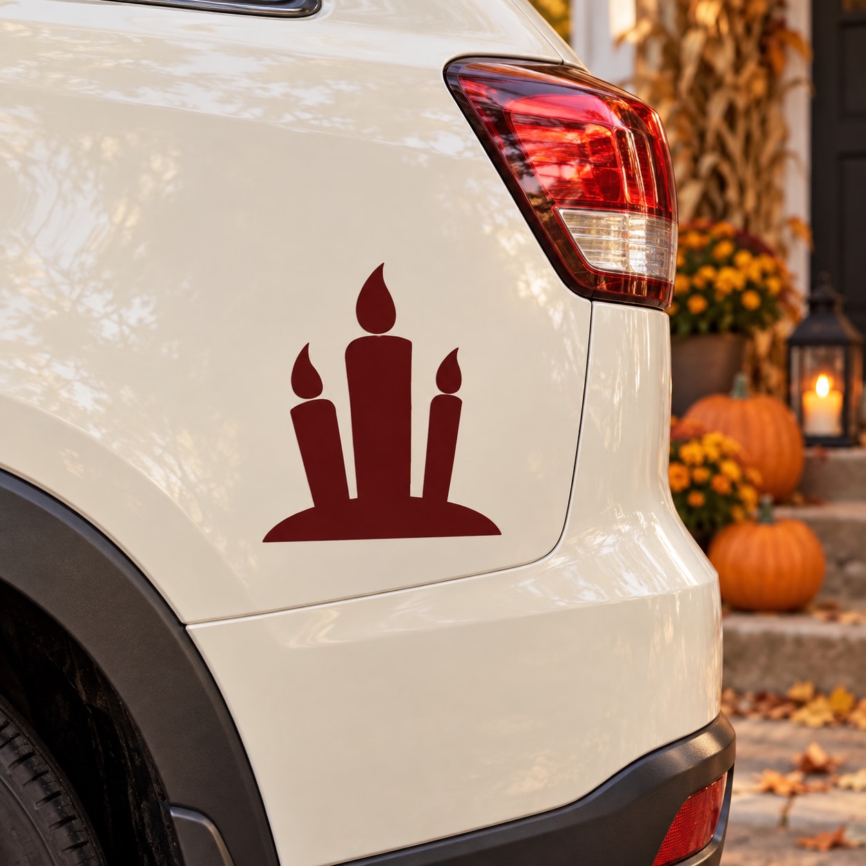 Three-candle Halloween decal: red candle silhouette set on white surface