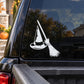 White witch hat and broomstick decal on dark car window