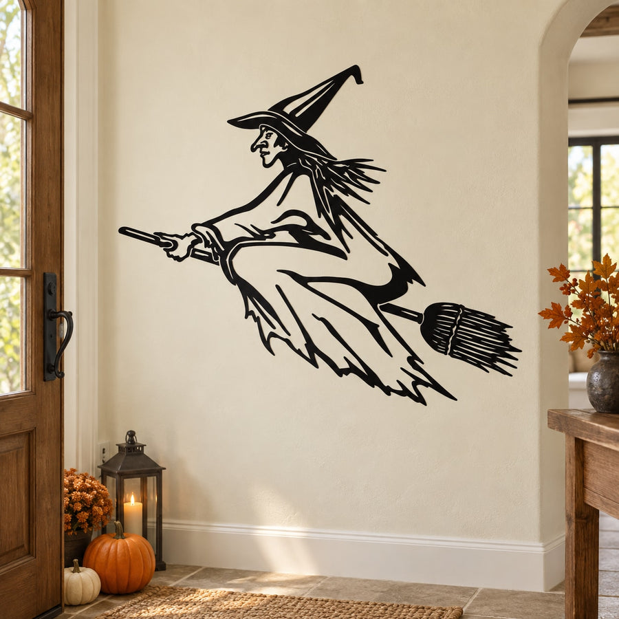 Flying witch outline decal, black line art of a witch on a broom in midair.