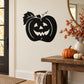 Black laughing jack-o-lantern decal with leaf details on wall