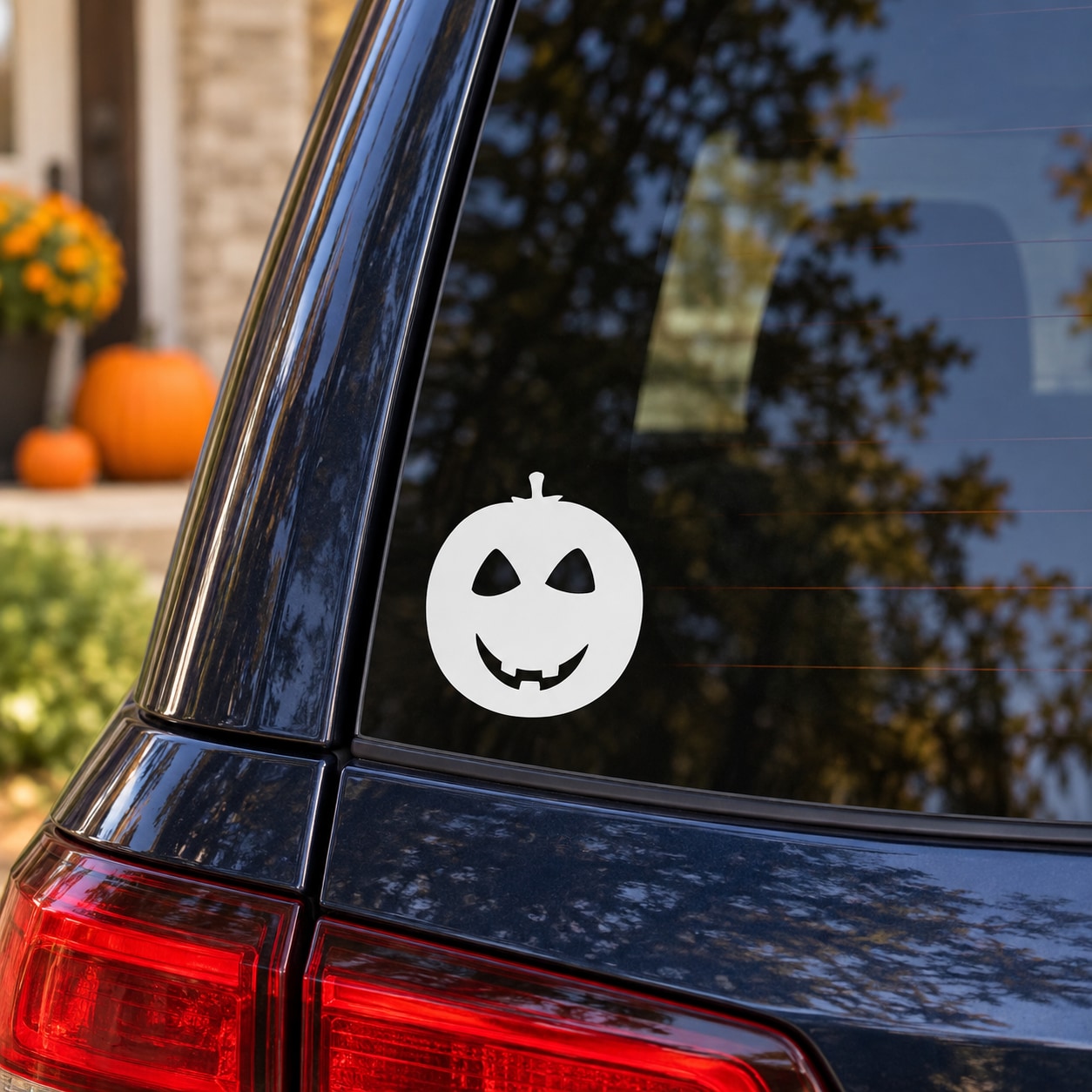 Halloween jack-o-lantern decal with slightly smiling face, white circle with black features