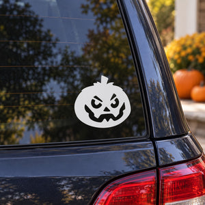 Angry jack-o-lantern decal: white circle with black scary face on vehicle window