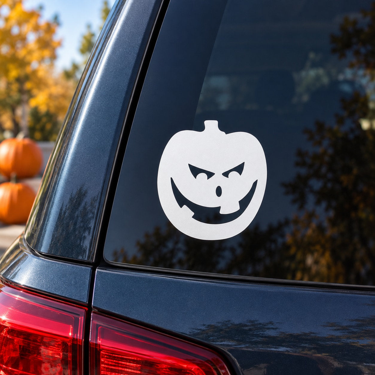 White jack-o-lantern evil grin decal for car window, round sticker with black face