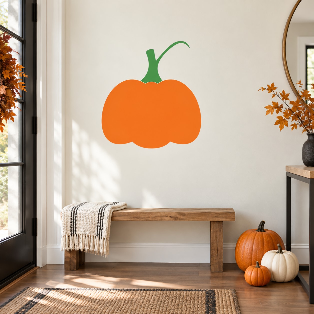 Orange pumpkin die-cut wall decal with green stem and leaf accents
