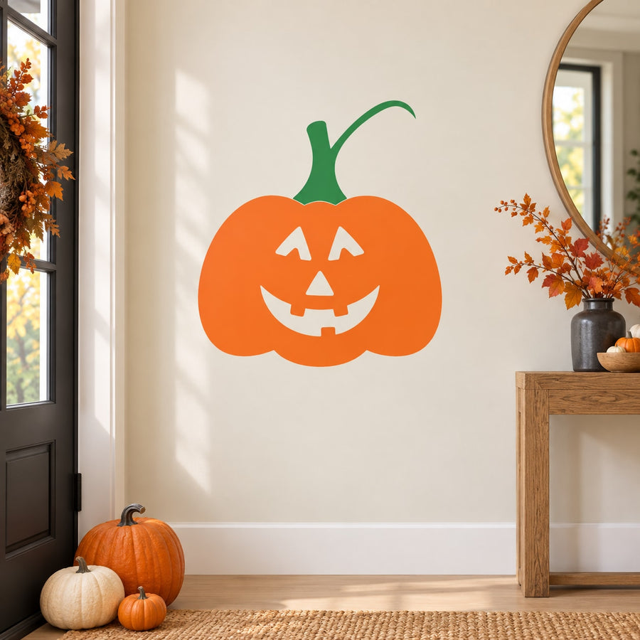 Orange jack-o-lantern decal with green stem and carved smile