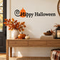Happy Halloween wall decal with orange pumpkin and black swirl lettering