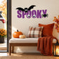 Halloween word decal with bat and spider, purple “Spooky” lettering
