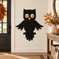 Black owl die-cut decal with orange beak and large round white-and-yellow eyes