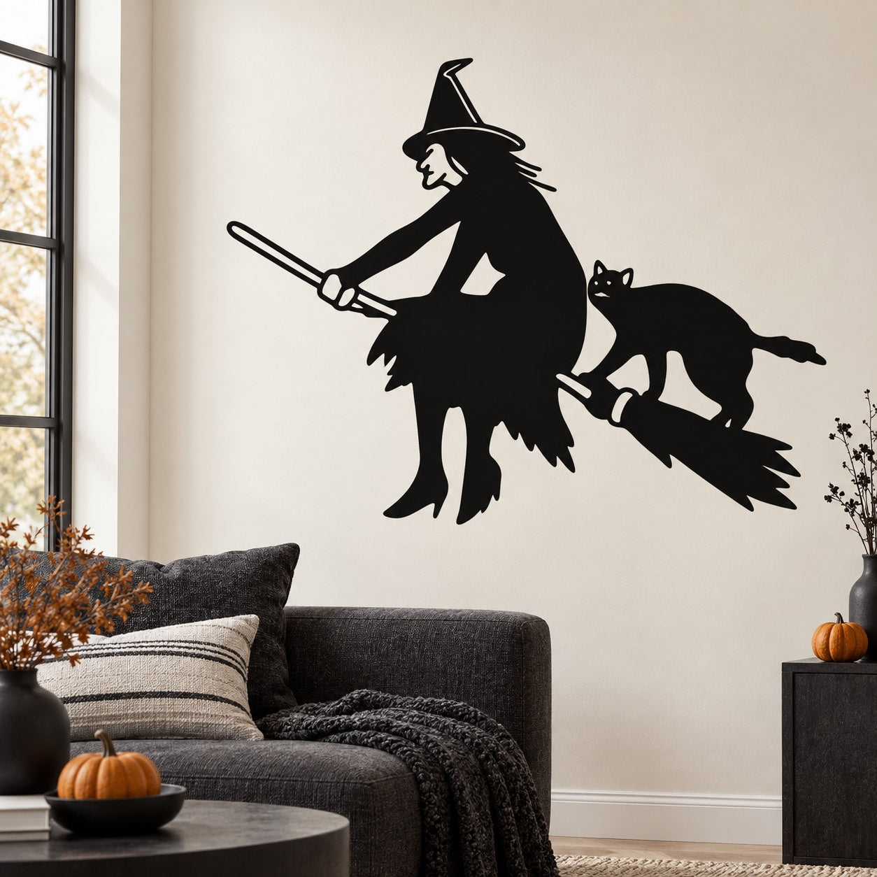 Witch riding broom wall decal with cat silhouette, black design