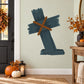 Leaning tombstone wall decal with dark blue headstone and brown wooden cross