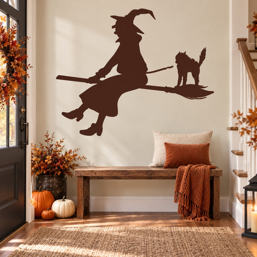 Dark brown witch silhouette riding broom with cat sticker wall decal